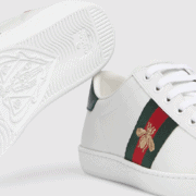 white leather gucci tennis shoes with green and red stripe and bee