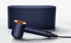 navy blue and copper dyson hair dryer laid flat