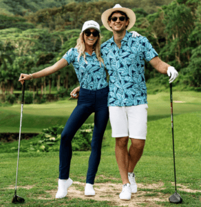 Girl and guy on golf course wearing matching golf polos