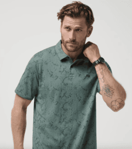 handsome brunette man wearing green golf polo