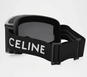 Black ski goggles that say Celine in white letters